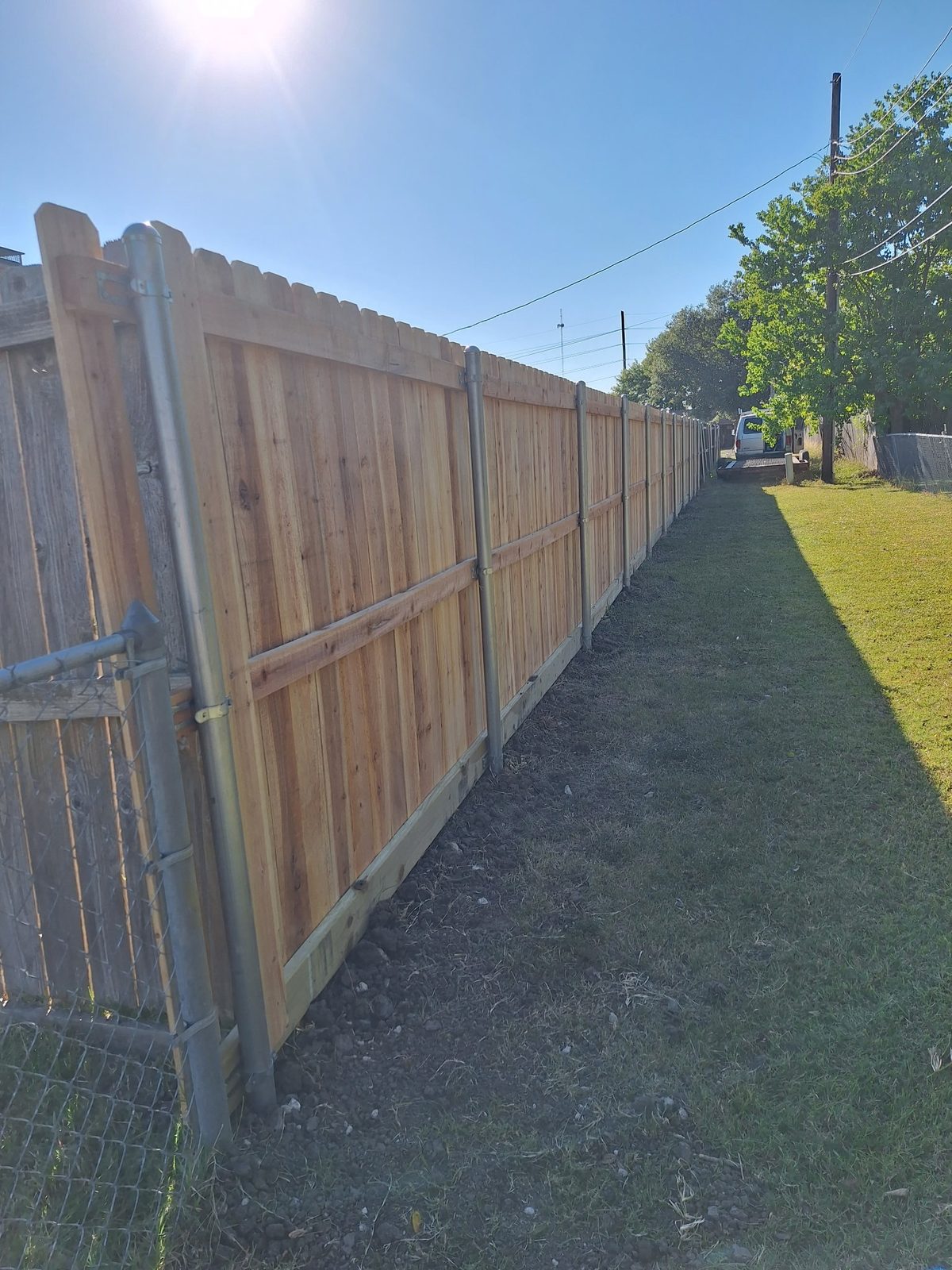 Dog-ear cedar privacy fence built on galvanized steel posts